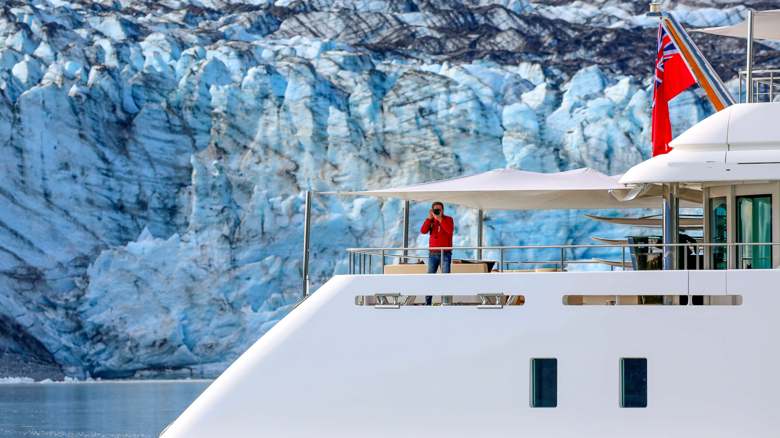 man on a boat, white boat, scenic background