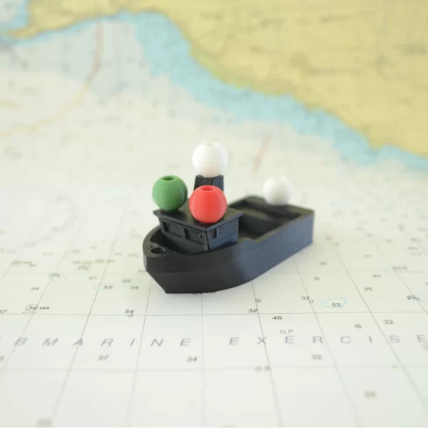 Image of a 3D printed small, powered vessel and its navigation lights